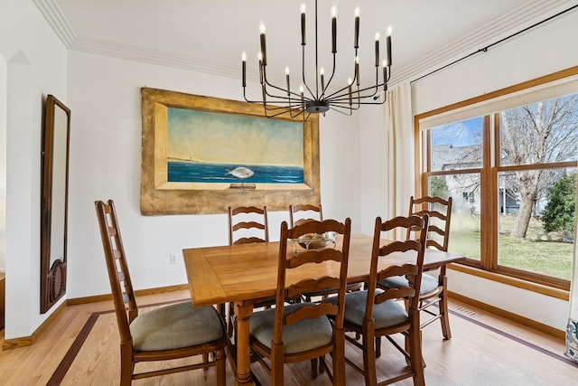 3412 Williamsburg Pkwy, Woodbury, MN 55129 - dining area with baseboards, light wood finished floors, a notable chandelier, and a healthy amount of sunlight