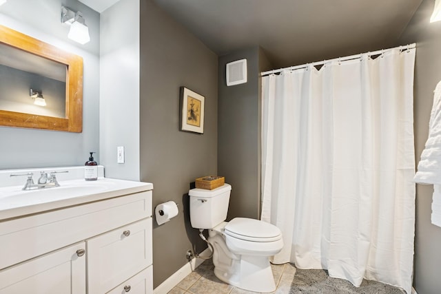 3412 Williamsburg Pkwy, Woodbury, MN 55129 - full bathroom with visible vents, tile patterned flooring, vanity, toilet, and baseboards