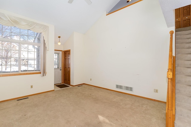 empty room featuring stairway, baseboards, carpet, and visible vents