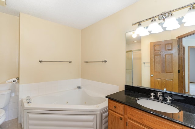 full bath featuring a jetted tub, a shower stall, toilet, and vanity