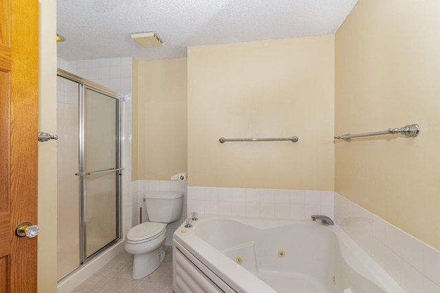 full bathroom with a jetted tub, a textured ceiling, tile patterned flooring, a stall shower, and toilet
