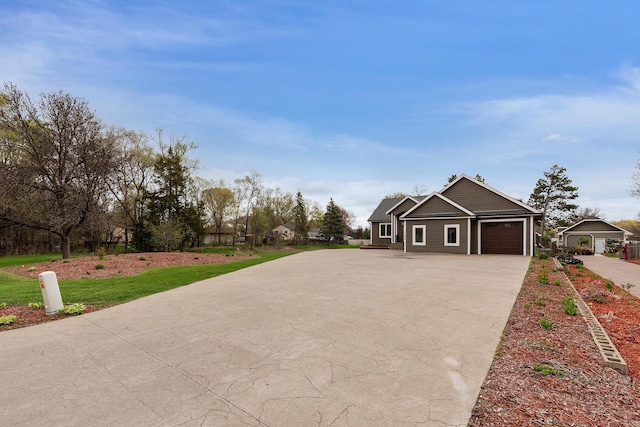 craftsman-style home with a garage and concrete driveway