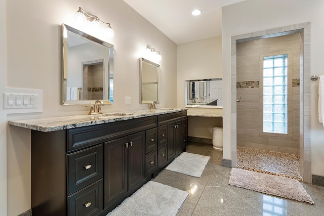 full bath with baseboards, a sink, and a healthy amount of sunlight