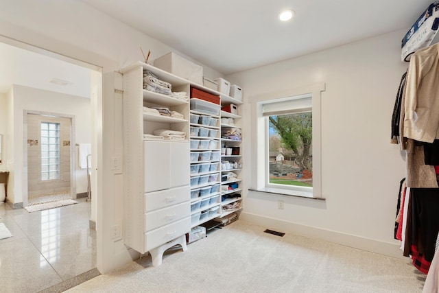 spacious closet featuring visible vents