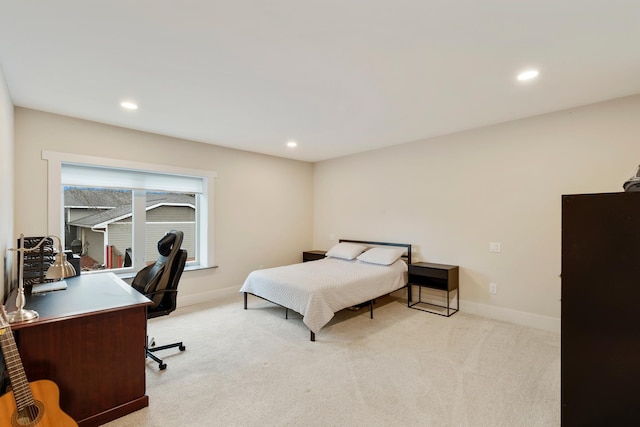 bedroom featuring recessed lighting, baseboards, and light carpet