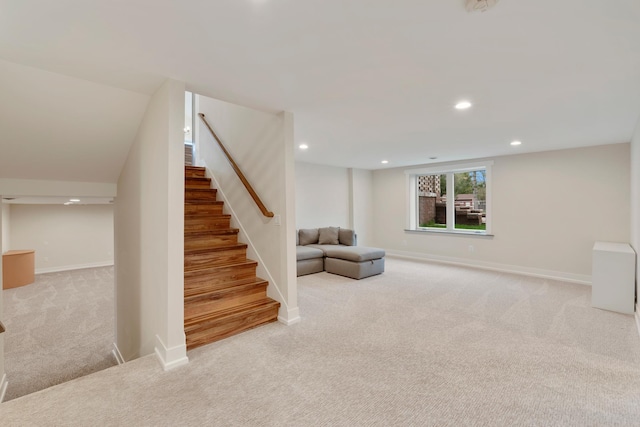 below grade area featuring stairs, recessed lighting, baseboards, and carpet