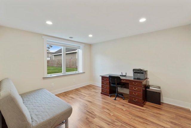 office space featuring baseboards, recessed lighting, and light wood-style flooring