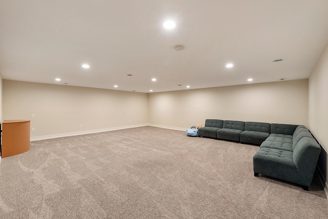 unfurnished living room with baseboards, light carpet, and recessed lighting