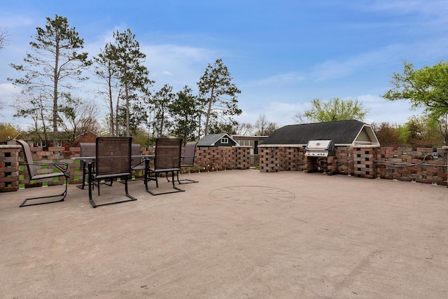 view of patio featuring an outdoor kitchen and outdoor dining space
