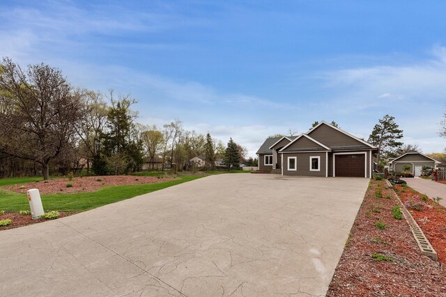 11824 Winnetka Ave N, Champlin, MN 55316 - craftsman-style home with driveway and a garage