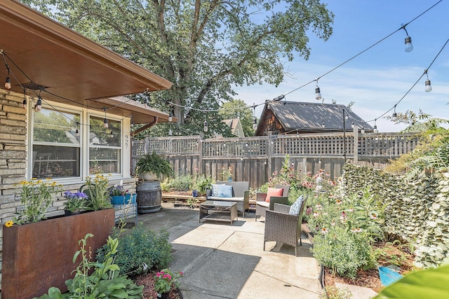 view of patio featuring fence and an outdoor living space