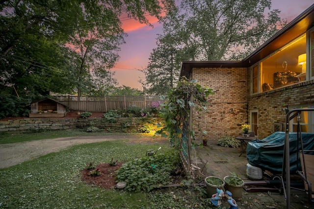 view of yard featuring a patio and fence