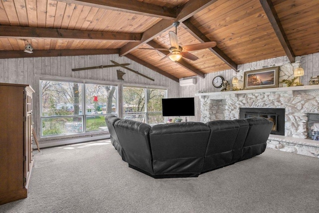 956 10th Ave SE, Forest Lake, MN 55025 - carpeted living area with a stone fireplace, wood ceiling, healthy amount of natural light, a ceiling fan, and wood walls