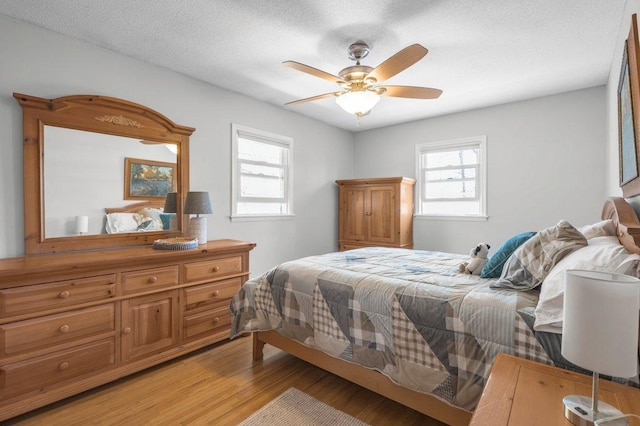 956 10th Ave SE, Forest Lake, MN 55025 - bedroom featuring light wood-style flooring and ceiling fan