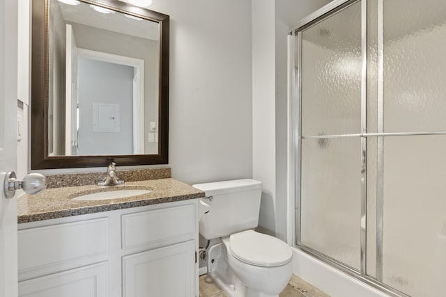 full bathroom with vanity, toilet, and a stall shower
