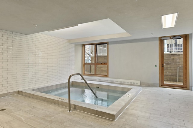 view of pool featuring an indoor in ground hot tub