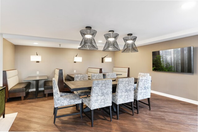 dining area with baseboards, recessed lighting, and wood finished floors