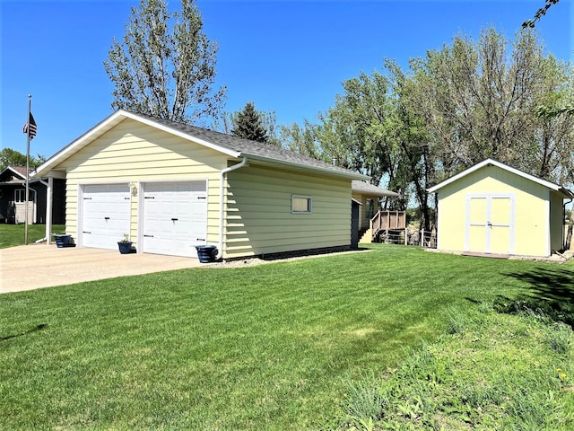 detached garage with a storage shed