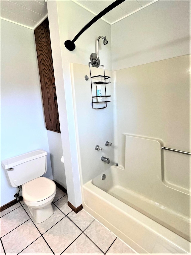 full bath with toilet, shower / tub combination, tile patterned flooring, and baseboards