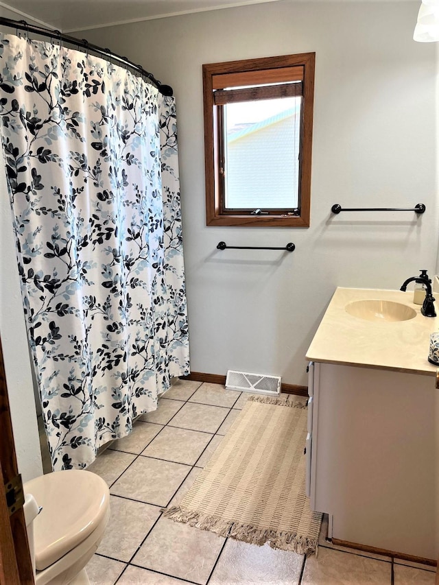 bathroom with tile patterned flooring, vanity, toilet, baseboards, and a shower with curtain