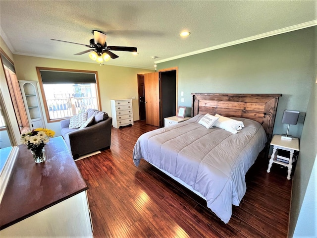 bedroom with a textured ceiling, crown molding, wood finished floors, and a ceiling fan