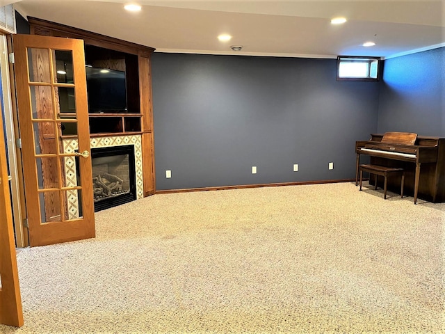 unfurnished room with carpet floors, recessed lighting, and a fireplace