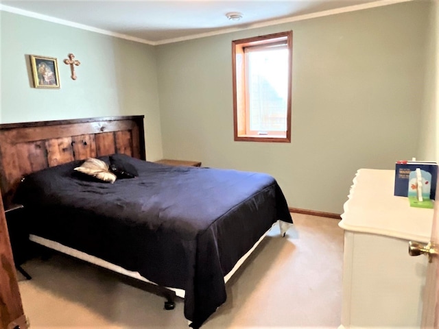 bedroom featuring ornamental molding, carpet floors, and baseboards
