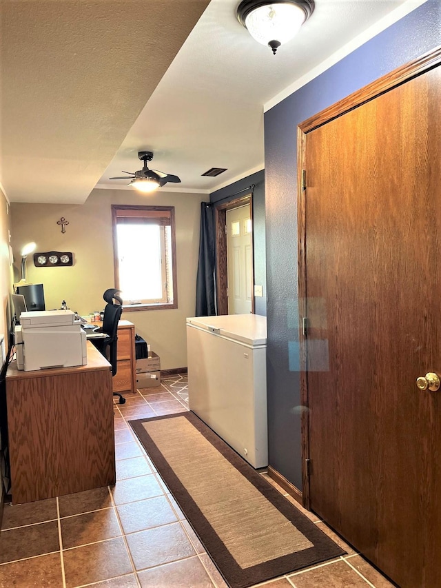 bathroom featuring a ceiling fan and tile patterned floors