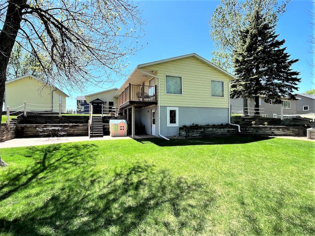 back of property with stairway, a patio area, a yard, and a wooden deck