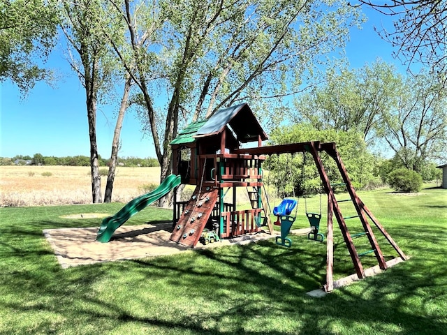 view of playground with a lawn