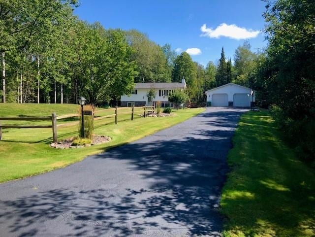5344 Shady Ln, Canosia Twp, MN 55811 - view of front of home with a front yard, an outdoor structure, and a garage