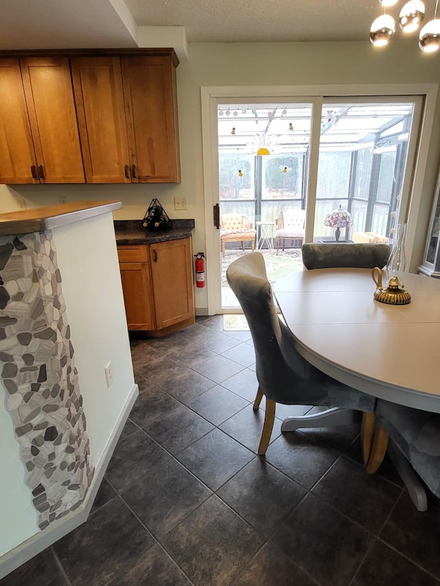 5344 Shady Ln, Canosia Twp, MN 55811 - dining space featuring dark tile patterned floors