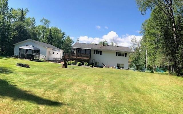 5344 Shady Ln, Canosia Twp, MN 55811 - back of house featuring an outdoor fire pit, a yard, a deck, and a gazebo