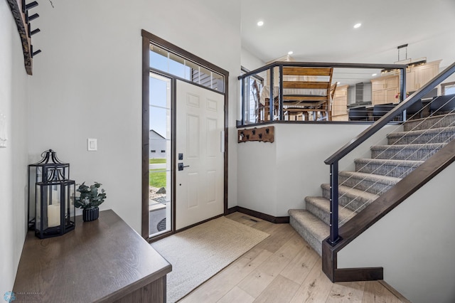 134 Newport Pkwy N, Kindred, ND 58051 - foyer featuring stairs, recessed lighting, and wood-type flooring