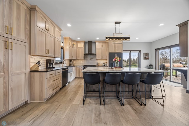 134 Newport Pkwy N, Kindred, ND 58051 - kitchen with backsplash, light brown cabinetry, a kitchen breakfast bar, and wall chimney exhaust hood