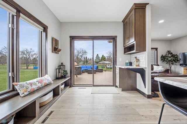 134 Newport Pkwy N, Kindred, ND 58051 - interior space with light wood-style floors, visible vents, recessed lighting, and plenty of natural light