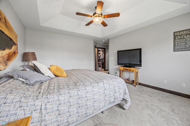 134 Newport Pkwy N, Kindred, ND 58051 - bedroom with carpet floors, a raised ceiling, baseboards, and a ceiling fan