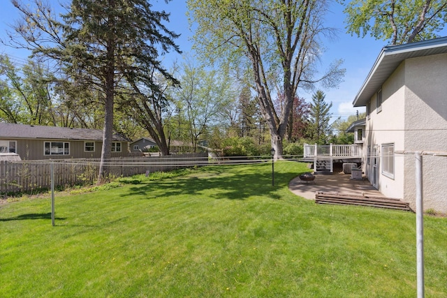 view of yard featuring a wooden deck