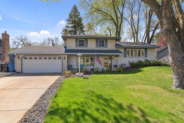 split level home with a garage, stucco siding, driveway, and a front lawn