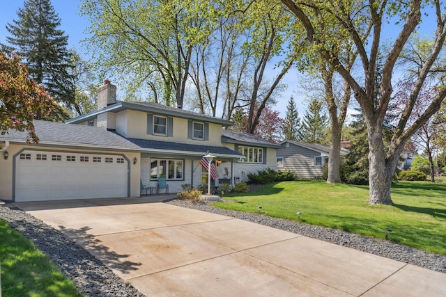 view of front of property featuring an attached garage, a chimney, concrete driveway, a front yard, and stucco siding