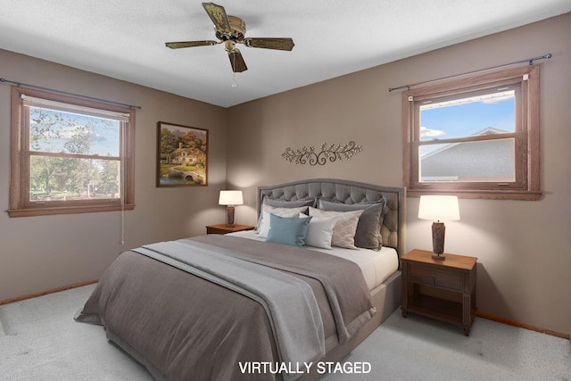 bedroom featuring carpet floors, baseboards, and ceiling fan