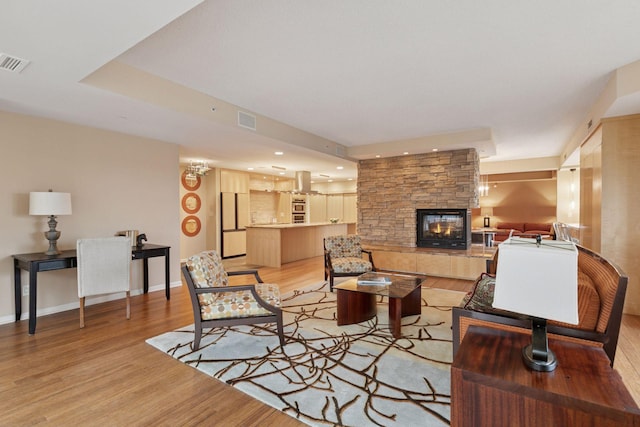 1235 Yale Pl Unit 1706, Minneapolis, MN 55403 - living area featuring visible vents, recessed lighting, a fireplace, and light wood-type flooring