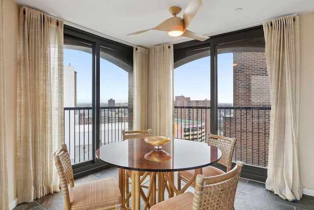 1235 Yale Pl Unit 1706, Minneapolis, MN 55403 - dining area featuring a wall of windows and ceiling fan