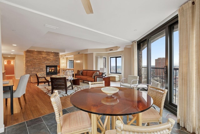 1235 Yale Pl Unit 1706, Minneapolis, MN 55403 - dining room featuring a stone fireplace and dark wood-style flooring