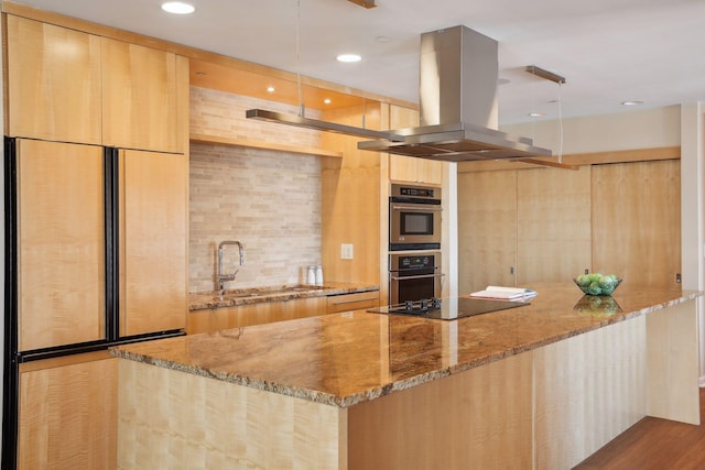 1235 Yale Pl Unit 1706, Minneapolis, MN 55403 - kitchen with black electric cooktop, light brown cabinets, island range hood, and modern cabinets