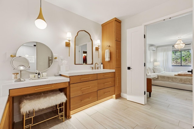 215 Barry Ave S Unit 116And 114, Wayzata, MN 55391 - bathroom featuring ensuite bath, wood finished floors, vanity, a wall unit AC, and baseboards