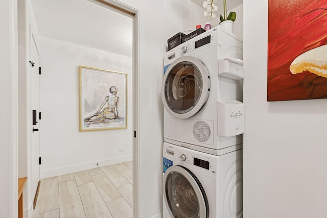 215 Barry Ave S Unit 116And 114, Wayzata, MN 55391 - washroom featuring stacked washer / drying machine and baseboards