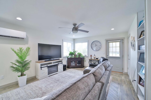 living area featuring a wall mounted AC, a ceiling fan, recessed lighting, and wood finished floors