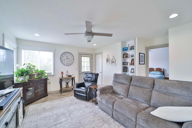 living area featuring recessed lighting and ceiling fan