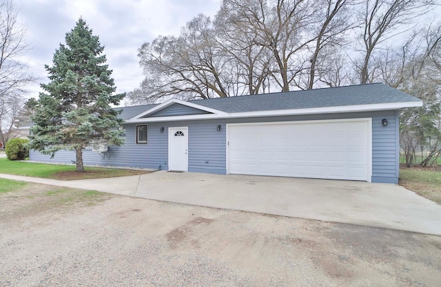 ranch-style house with driveway and a garage